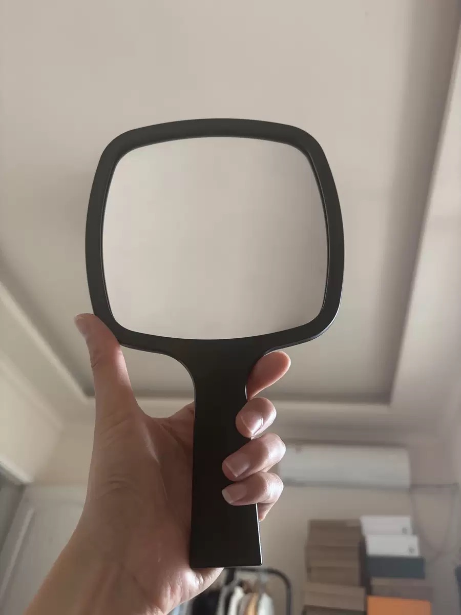 Square handheld mirror sample shown from the mirror side
