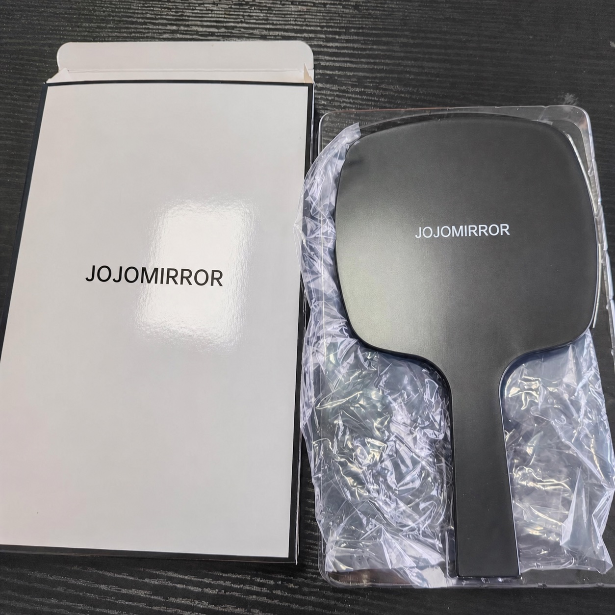 Paid handheld mirror sample with protective bag, blister support and paper box