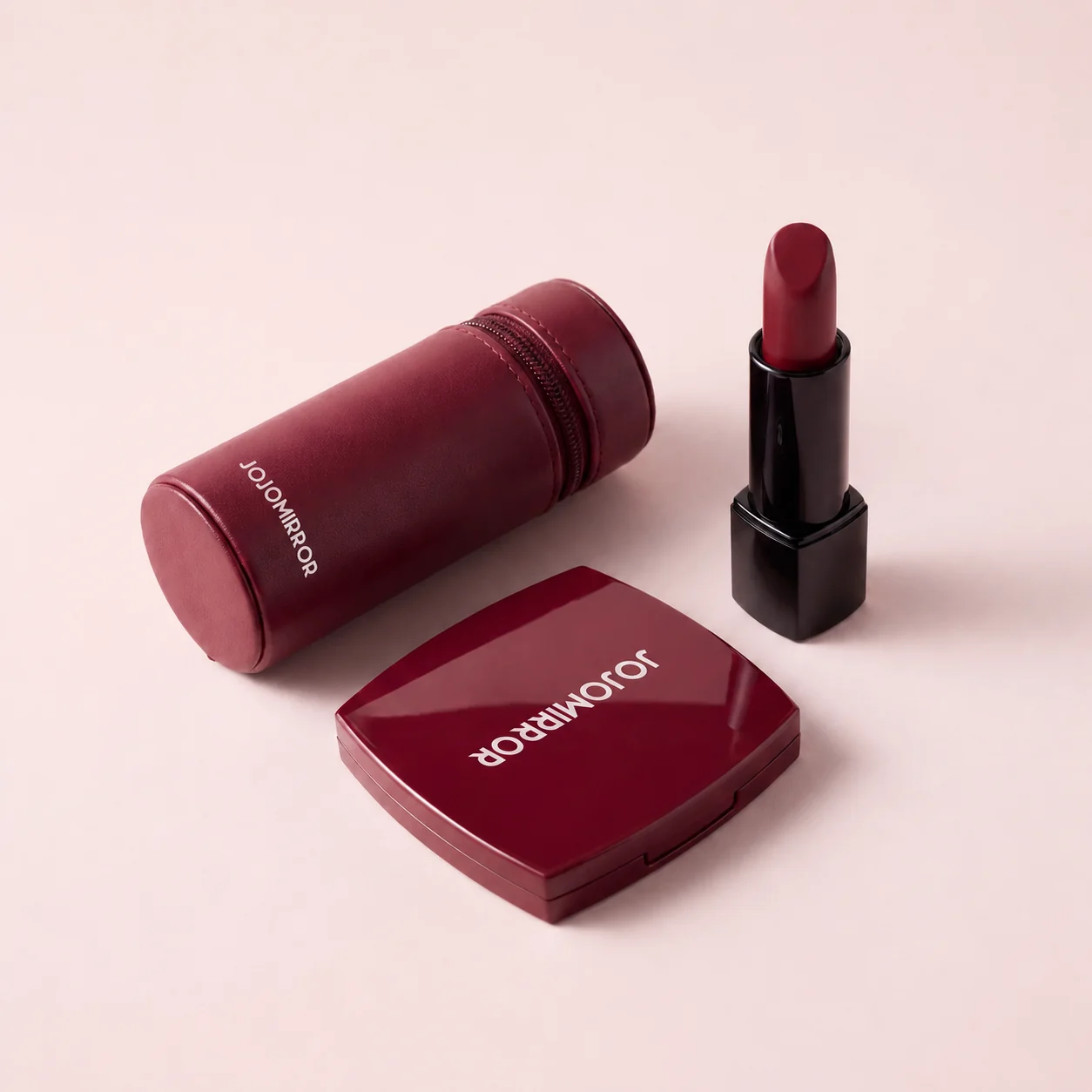 Burgundy compact mirror lipstick and cylindrical zip pouch set