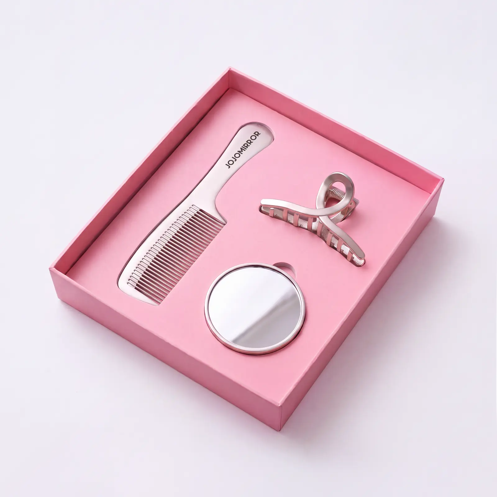 Pink gift box containing mirror comb and hair clip
