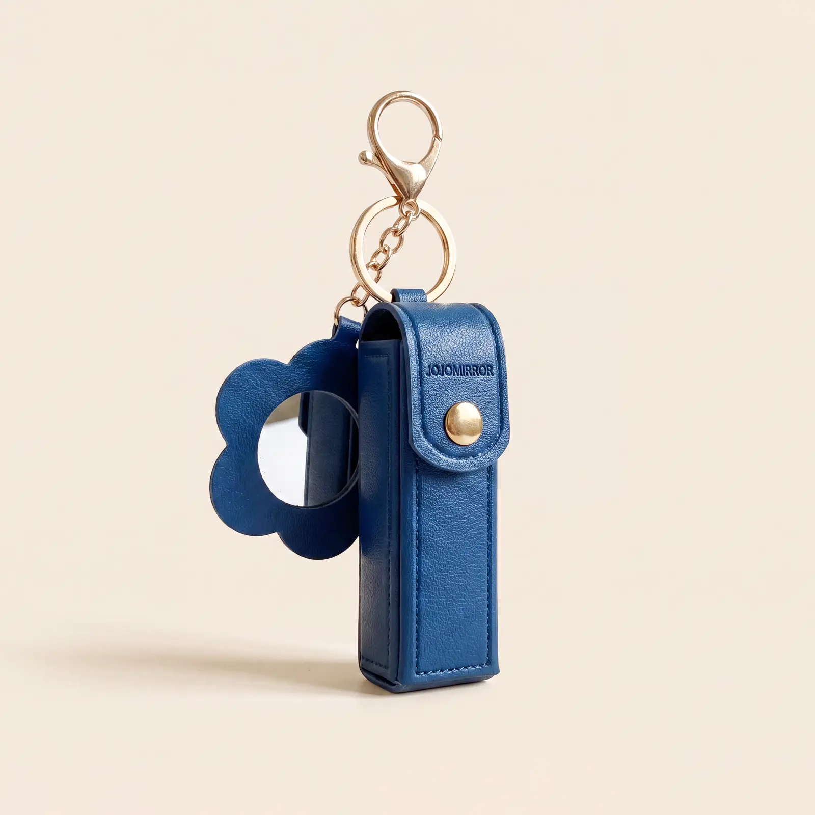 Blue flower-shaped keychain mirror with matching rectangular pouch