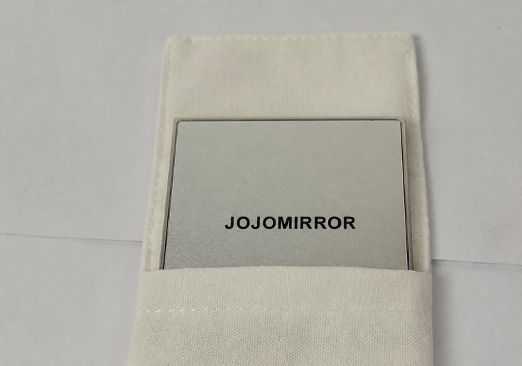 Square polished metal compact mirror in a protective pouch for a UK beauty brand project